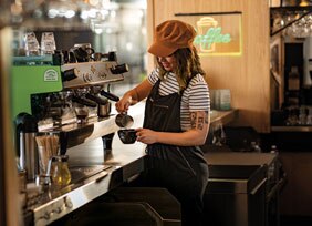 pouring oat milk into Chameleon brew pouring oat milk into Chameleon brew