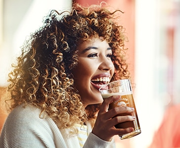 Student Holding Starbucks Chameleon Beverage