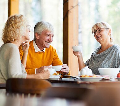 Group Enjoying Coffee in a Senior Living Community Residential Café Group Enjoying Coffee in a Senior Living Community Residential Café