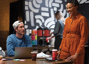 Man and Woman Working in Coffee Shop With Seattle’s Best Coffee Beverages Man and Woman Working in Coffee Shop With Seattle’s Best Coffee Beverages