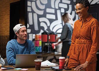Man and Woman Working in Coffee Shop With Seattle’s Best Coffee Beverages Man and Woman Working in Coffee Shop With Seattle’s Best Coffee Beverages