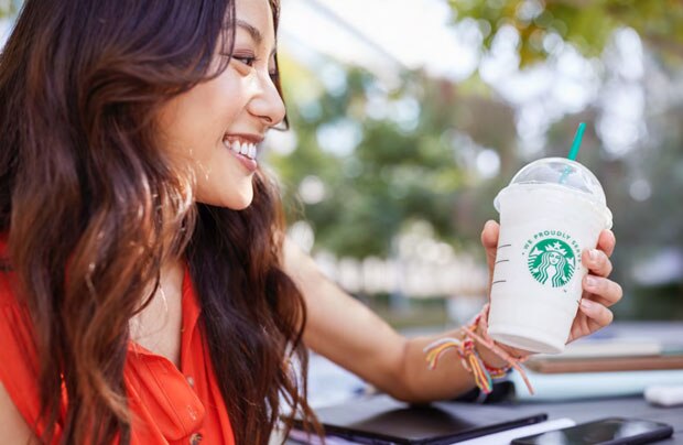 Woman Holding Starbucks Frappuccino Cup